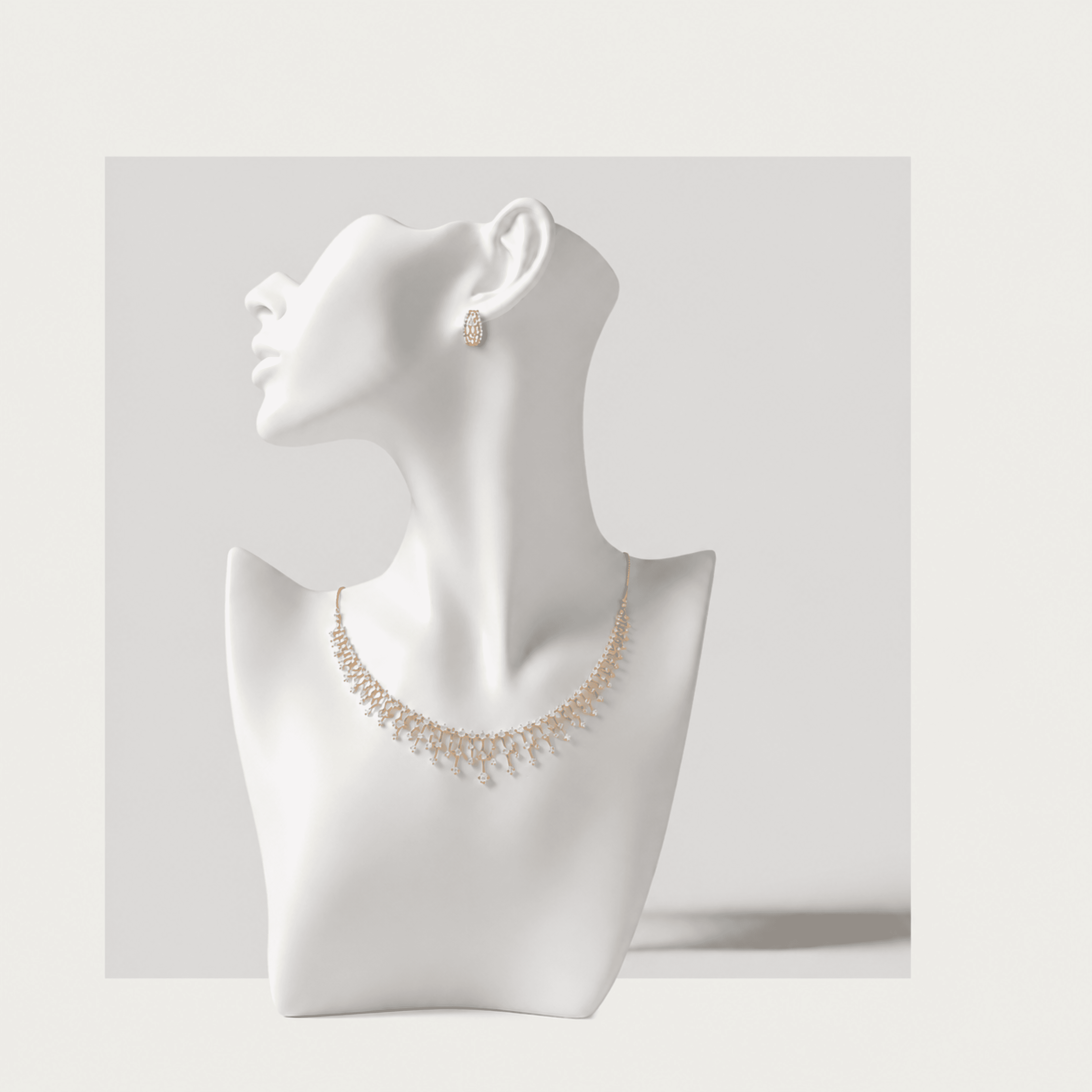 S&J diamond necklace and earring on a display bust